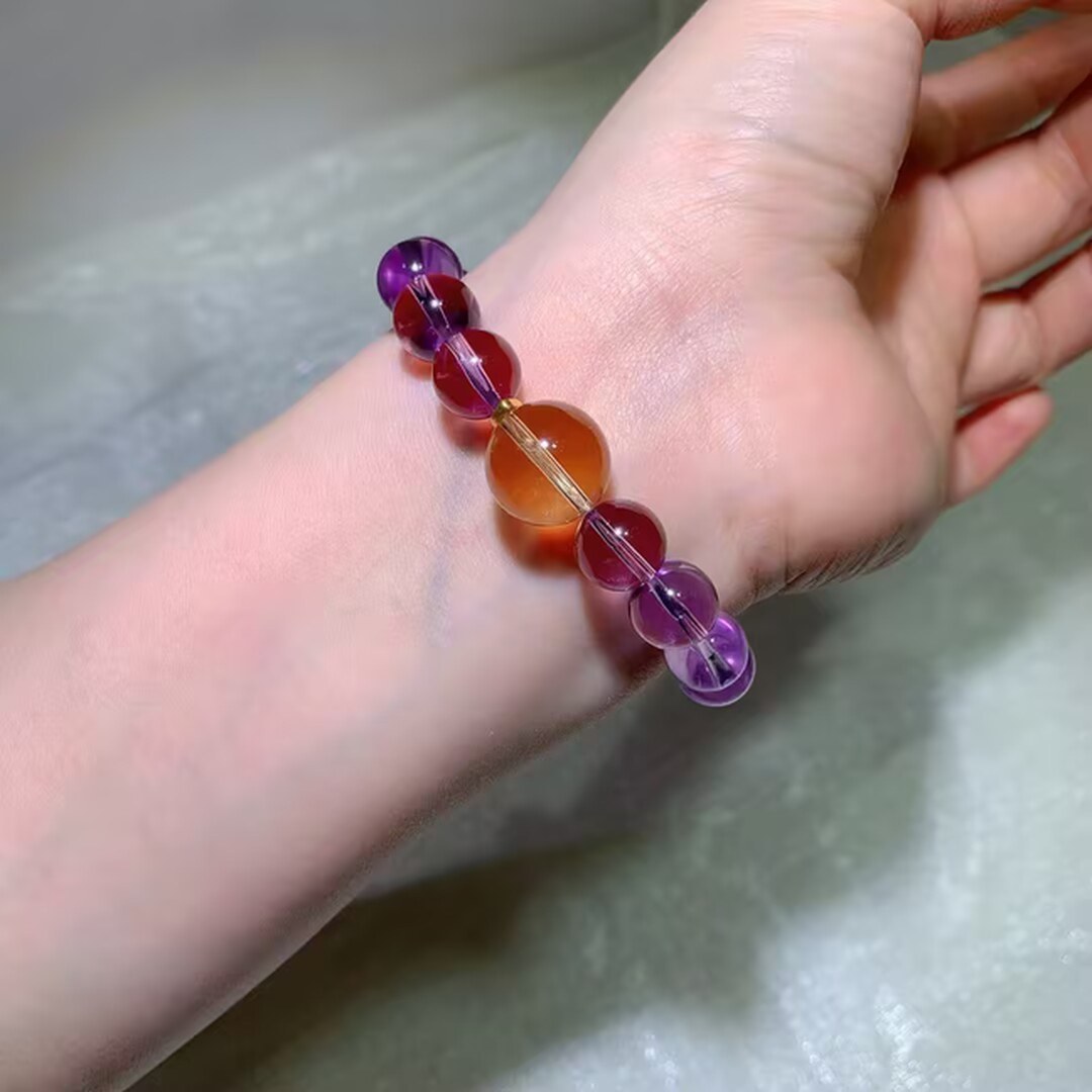 Natural amethyst bracelet with a large citrine bead in daylight