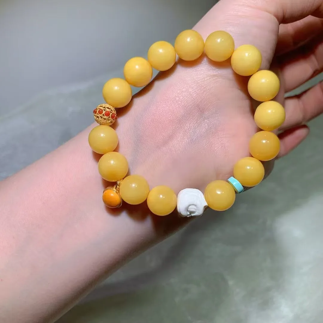 Beeswax Amber Bracelet · Carved White Charm & Colorful Beads · 11.6mm — detail photo