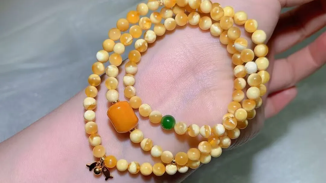 Natural beeswax amber multi-wrap bracelet with buttery-yellow and creamy-white beads