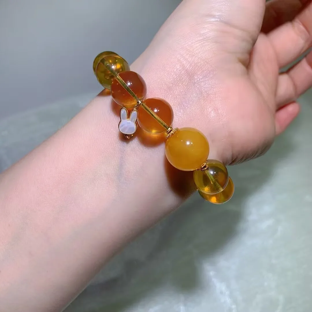 Blue Amber Bracelet · Honey Round Bead & Rabbit Charm · 13.7mm — detail photo