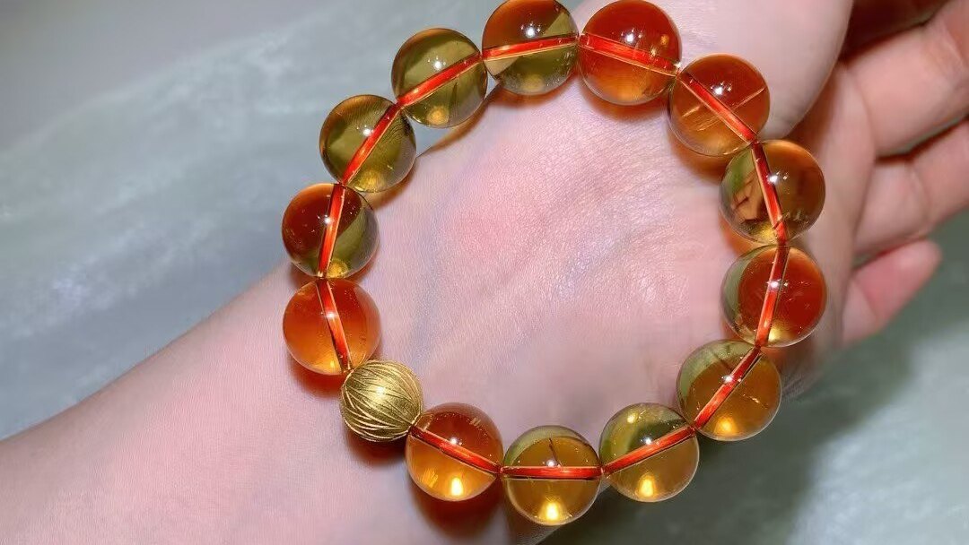 Natural Brazilian citrine bracelet with large clear golden-to-orange beads on a wrist