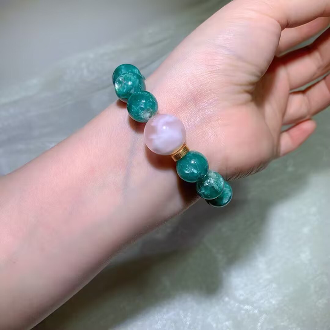 Teal-green emerald quartz beads with tiny sparkling flecks inside