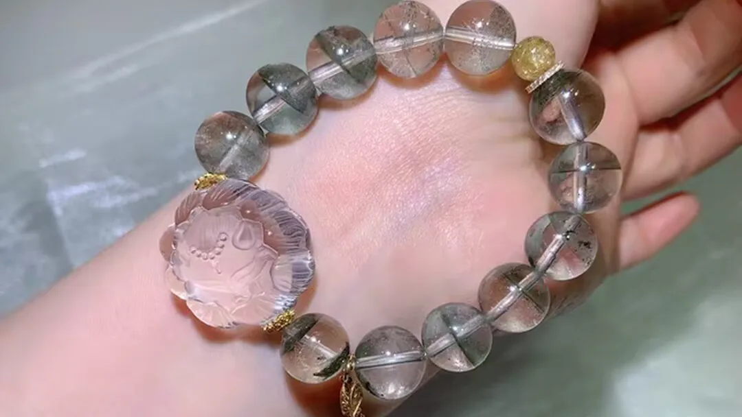 Natural green phantom crystal bracelet with a carved flower-bud fox centerpiece