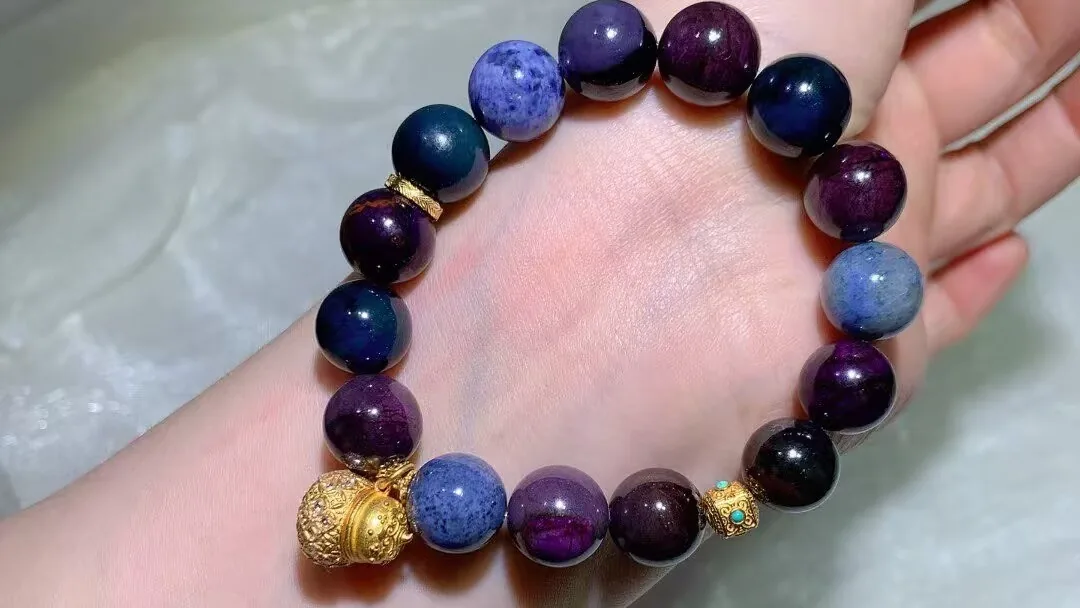 Natural sugilite bracelet with plum-purple, deep violet and midnight-blue beads